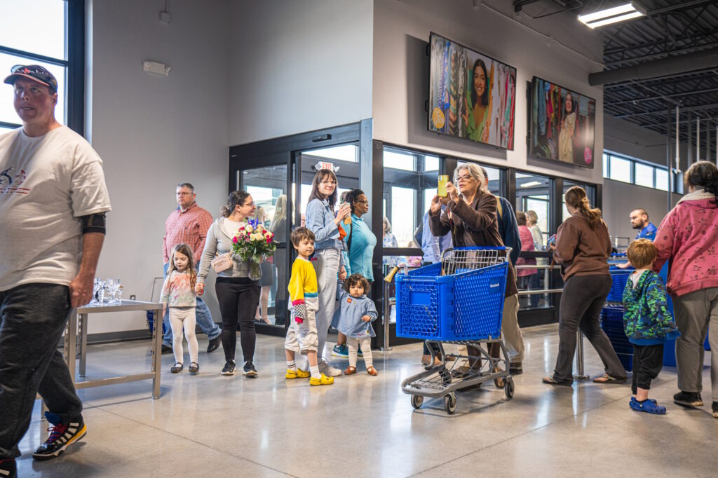 People gathered inside the entrance of the new store