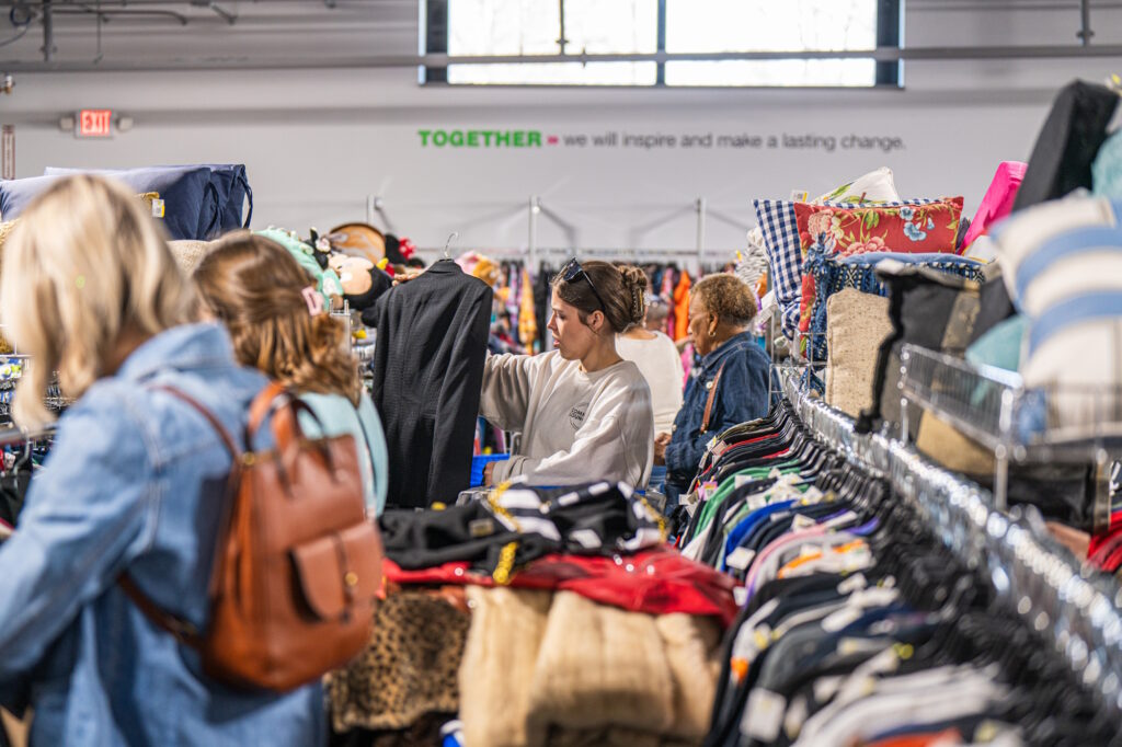 Shoppers looking at clothing items