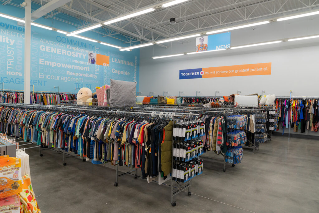 Inside Goodwill Store with clothing items on racks